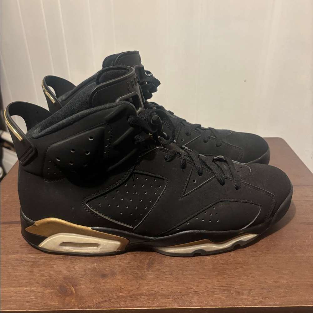 Jordan Black and Gold Sneakers with Iconic Design